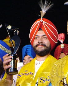 Harpreet Singh (centre) who was crowned as Mr Singh International with runners-up Inderdeep Singh (right) and Inderjit Singh (left) during the Mr Singh International pageant held in Amritsar on November 20.