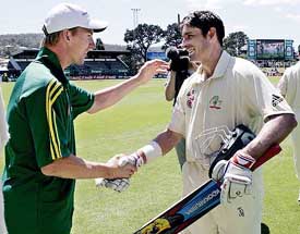 Man-of-the-match Australian opening bastman Michael Hussey is congratulated by team-mate Brett Lee after the second Test against the West Indies in Hobart on Monday