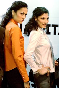 Models Sonalika Sahay and Indrani Dasgupta pose with the Easy-Stretch collection of Park Avenue in New Delhi on Tuesday. 