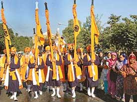 Devotees take part in a shobha yatra held in connection with the martyrdom day of Guru Teg Bahadur in Chandigarh on Tuesday