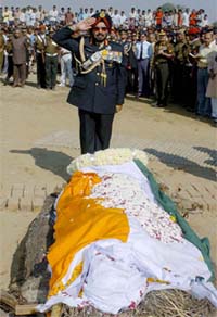 Chief of Army staff Gen J J Singh salutes the mortal remains of Victoria Cross Umrao Singh at Palra village, 100 km from New Delhi