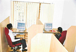 Teachers at work in a Kochi centre that conducts e-tutoring for students in the USA
