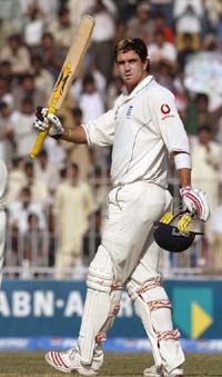 Englands Kevin Pietersen acknowledges the crowd after completing his century against Pakistan on the third day of the second cricket Test in Faisalabad on Tuesday