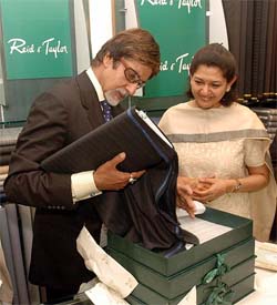 Brand ambassador of Reid & Taylor Amitabh Bachchan admires a new collection in Mumbai