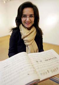 Sothebys Selei Serafin displays one of Ludwig von Beethovens last manuscript scores during a pre-auction presentation in Cologne