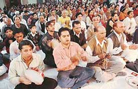 Devotees recite bhajans as part of the 80th birthday celebrations of Sri Sathya Sai Baba in Sector 19, Chandigarh, on Wednesday. 