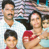 In this undated family photograph, kidnapped Indian driver who worked for the Border Roads Organisation, Maniappan Raman Kutty is pictured with his family at Chingoli village in the Alappuzha district of Kerala