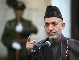 Afghan President Hamid Karzai speaks in Kabul on Wednesday about the killing of an Indian by the Taliban in the southern province of Nimroz