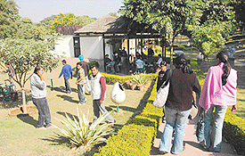 COFFEE BREAK: Students of the College of Arts enjoy the sunshine and a hot cup of coffee.