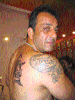Sanjay Dutt shows off his tattoos by the artist. 