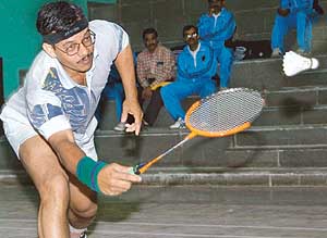 Alok Nobel from Damodar Valley Corporation bends to return on the opening day of the 32nd All-India Inter-Electricity Boards Badminton Tournament at Sector 3 Sports Complex, Panchkula, on Friday.