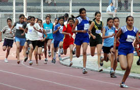 Girls during the 800 m race on the opening day of the 51st Punjab State Schools Athletics Meet in Ludhiana on Saturday