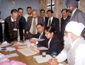 Mr Justice Viney Mittal of the Punjab and Haryana High Court along with the District and Sessions Judge, Mr Harbans Lal, at the lok adalat at judicial complex in Ludhiana on Sunday