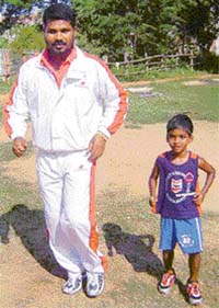 Three-year-old Budhia with his coach Biranchi Das