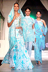Models present creations by designer JJ Valaya during a fashion show produced by Harmeet Bajaj in Amritsar on Saturday evening