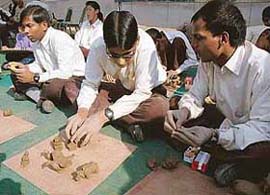 Blind participants make models with clay at the Chandigarh Carnival in Sector 10, Chandigarh