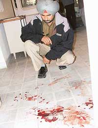 Blood spots seen on the floor where Prem Nath Devgan was found murdered on Sunday.