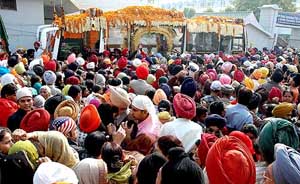 The golden palanquin passes through a Ludhiana street on its way to Nankana Sahib on Monday. 