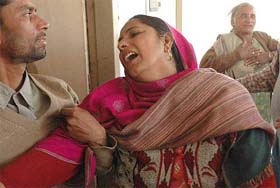 The wife of Punjab Police Head Constable Raj Kumar, who died in the bus-truck collision, in an inconsolable condition in Balachaur Civil Hospital