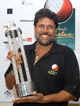 Kapil Dev holds the trophy after winning the individual event of the Signature McDowells World Cup of Golfing Cricketers at the Karnataka Golf Association ground in Bangalore on Sunday