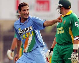 Irfan Pathan celebrates after dismissing South Africas Graeme Smith  as Jacques Kallis looks on during the fifth and final one-day international in Mumbai on Monday