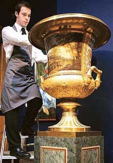 An employee at Christies auction house is seen beside one of the pairs of monumental two-handed Campana vases in London