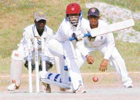 Sunil K. Jain of Karnataka plays a shot during the first innings of Elite group A Cooch Behar Trophy match being held at Sector 16 stadium in Chandigarh