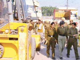 Police personnel are left and high dry after a demolition drive was cancelled at Railla village in Panchkula