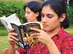 University students taking time out to read their favourite authors.