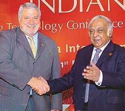 Mr Subir Raha, Chairman and Managing Director, ONGC (right) shakes hands with Mr G. Paccaloni, International President of the Society of Petroleum Engineers (SPE), at a press conference in New Delhi on Thursday. 