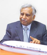 Chairman of Jet Airways Naresh Goyal interacts with the media at the opening of the first UPS store at Mumbai on Thursday. The store provides full service retail concepts, combining packaging, shipping and other business services such as ticketing. UPS is the worlds largest package delivery company and a global leader in supply chain services. 