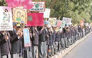 World AIDS Day: Students from different schools of Chandigarh form a human chain against AIDS on World AIDS Day in Chandigarh on Thursday.