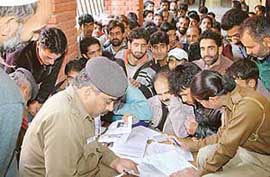 Police personnel verify the antecedents of Kashmiri migrants at the Sector 19 police station in Chandigarh on Thursday.