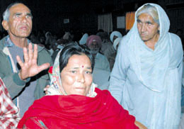 An ex-serviceman and widows of BSF personnel express their grievances at BSF headquarters in Jalandhar on Thursday