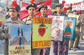 Volunteers of the NCC and the NSS from different colleges participate in an awareness rally to observe World AIDS Day in Ludhiana on Thursday
