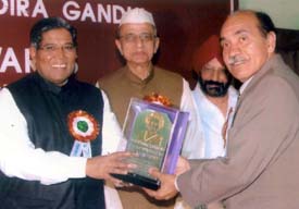 Dr Ravinder Kochhar, Principal, Lord Mahavira Homoeopathic Medical College, Ludhiana, receives Indira Gandhi Sadbhavna Award from Mr Rahman Khan, Deputy Chairman, Rajya Sabha, in New Delhi