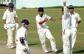 Haryanas Mahesh Rawat is caught by Punjabs Ravneet Ricky off the bowling of Dinesh Mongia on the first day of the Ranji Trophy match at the PCA Stadium in Mohali