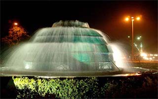 The fountain at the Rose Garden roundabout enlivens the evening in Chandigarh