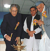 Lt. Governor B. L. Joshi with Delhi Health Minister Yoganand Shastri lighting the lamp during the inauguration of the 11th Jain Doctors International Conference in the Capital on Saturday.