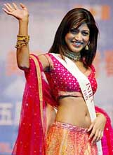 Miss India Sindhura Gadde waves to the audience attending a charity auction in Shanghai, China, on Friday. 