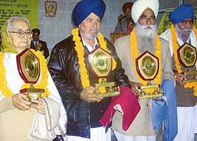 From left: Prof Jagir Kaur Komal, Rabbi Behronpuri, Sardara Singh and Angrez Singh during the annual awards ceremony of the Puadhi Punjabi Sath in Mohali
