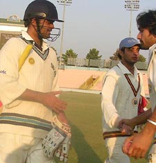 Punjab skipper Dinesh Mongia shakes hands with a Haryana player after the conclusion of the Ranji Elite Group B match at the PCA Stadium in Mohali on Sunday