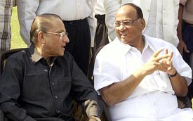 Newly elected BCCI President Sharad Pawar talks to former board chief Jagmohan Dalmiya before the start of the Working Committee meeting in Mumbai on Sunday