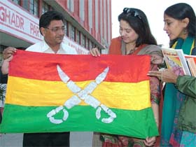 Noted Punjabi actress Preeti Sapru holds the Ghadar Partys flag in Jalandhar