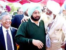 Chief Minister Capt Amarinder Singh embraces an elderly man from his ancestral village Mehraj on Monday. 