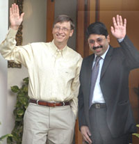 Dayanidhi Maran, Union Minister for Communications and IT, and Bill Gates, Chairman and Founder of Microsoft, wave at newsmen in New Delhi on Tuesday.