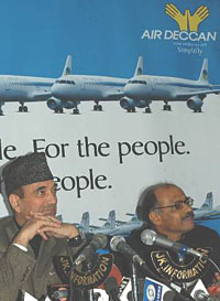Jammu and Kashmir Chief Minister Ghulam Nabi Azad (left) and the Managing Director of Air Deccan, Capt G.R. Gopinath, address a press conference in Srinagar on Tuesday.