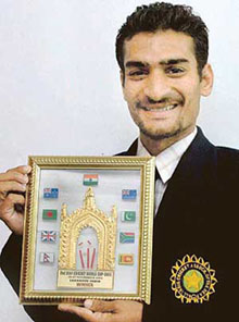Vinay Singhal, captain of the Chandigarh deaf and dumb cricket team, with a trophy he got during the Pakistan tour.