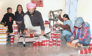 Bridal churas meant for poor girls being made by Channa Chure Wala at his residence.