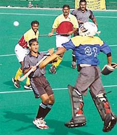Raja Raman, goalkeeper of South Zone, clears the ball against West Zone during the 35th All-India FCI Inter-Zone Hockey Tournament at Sector 42, Chandigarh